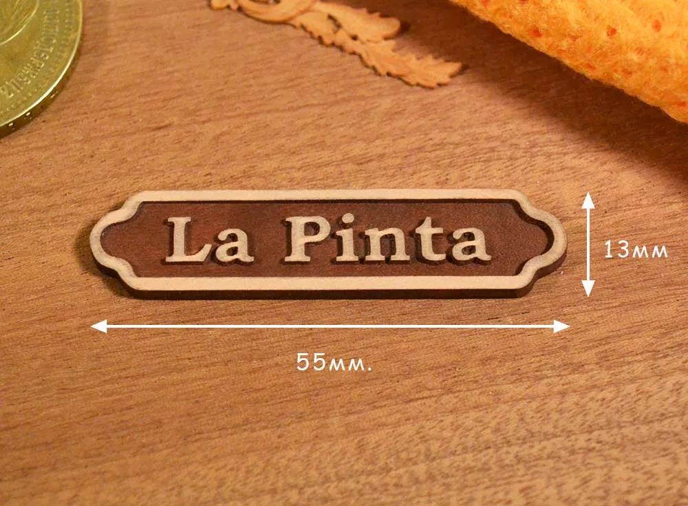 Темная табличка La Pinta, груша, рез ЧПУ